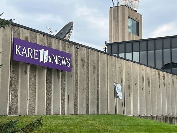The building exterior for TV station KARE-11, featuring a purple and white sign that reads "KARE-11 News."