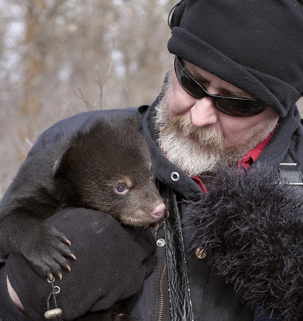 Dan holding a bear cub