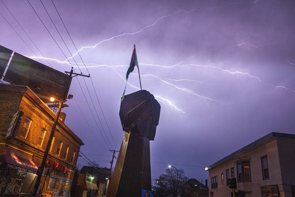 Lightning over a statue