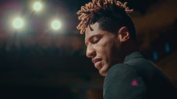 A man playing piano onstage