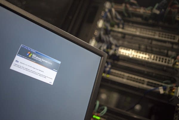A computer running a Windows Server is seen connected into a network server in an office building in Washington, DC on May 13, 2017. International investigators hunted on May 13 for those behind an unprecedented cyber-attack that affected systems in dozens of countries, including at banks,…
