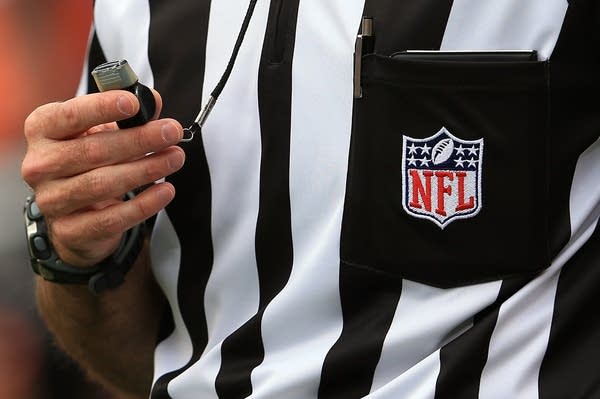 DENVER, CO - SEPTEMBER 23:  A detail of the uniform and whistle of an NFL referee as he oversees the action between the Houston Texans and the Denver Broncos at Sports Authority Field at Mile High on September 23, 2012 in Denver, Colorado. The Texans defeated the Broncos 31-25.