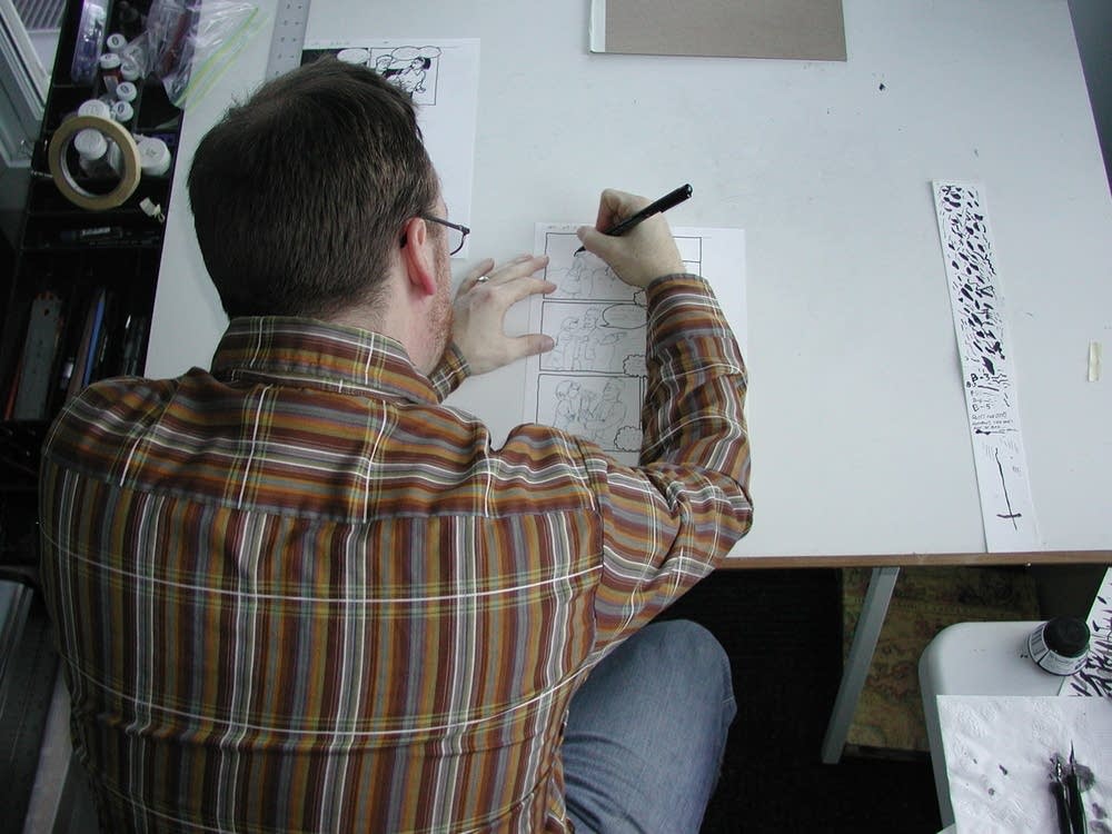 At the drawing table