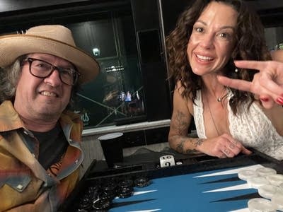 Two people play a board game