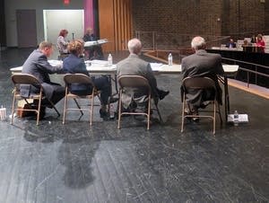 Nora Felton speaks at the podium during a public hearing.