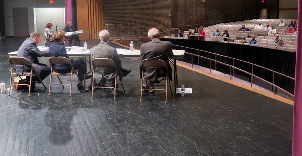 Nora Felton speaks at the podium during a public hearing.