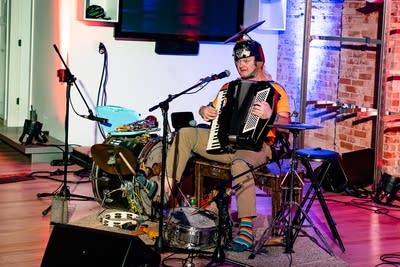 one person band performing on stage