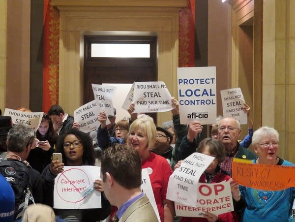 Protesters waved signs and chanted outside the Senate chamber.