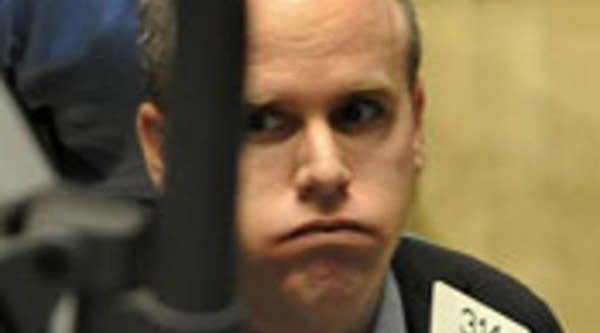 Trader on the floor of the New York Stock Exchange reacts to share losses on Friday, Oct. 10, 2008.