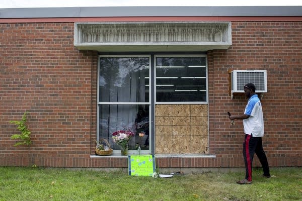 Abdul Mohamed photographs the damage.