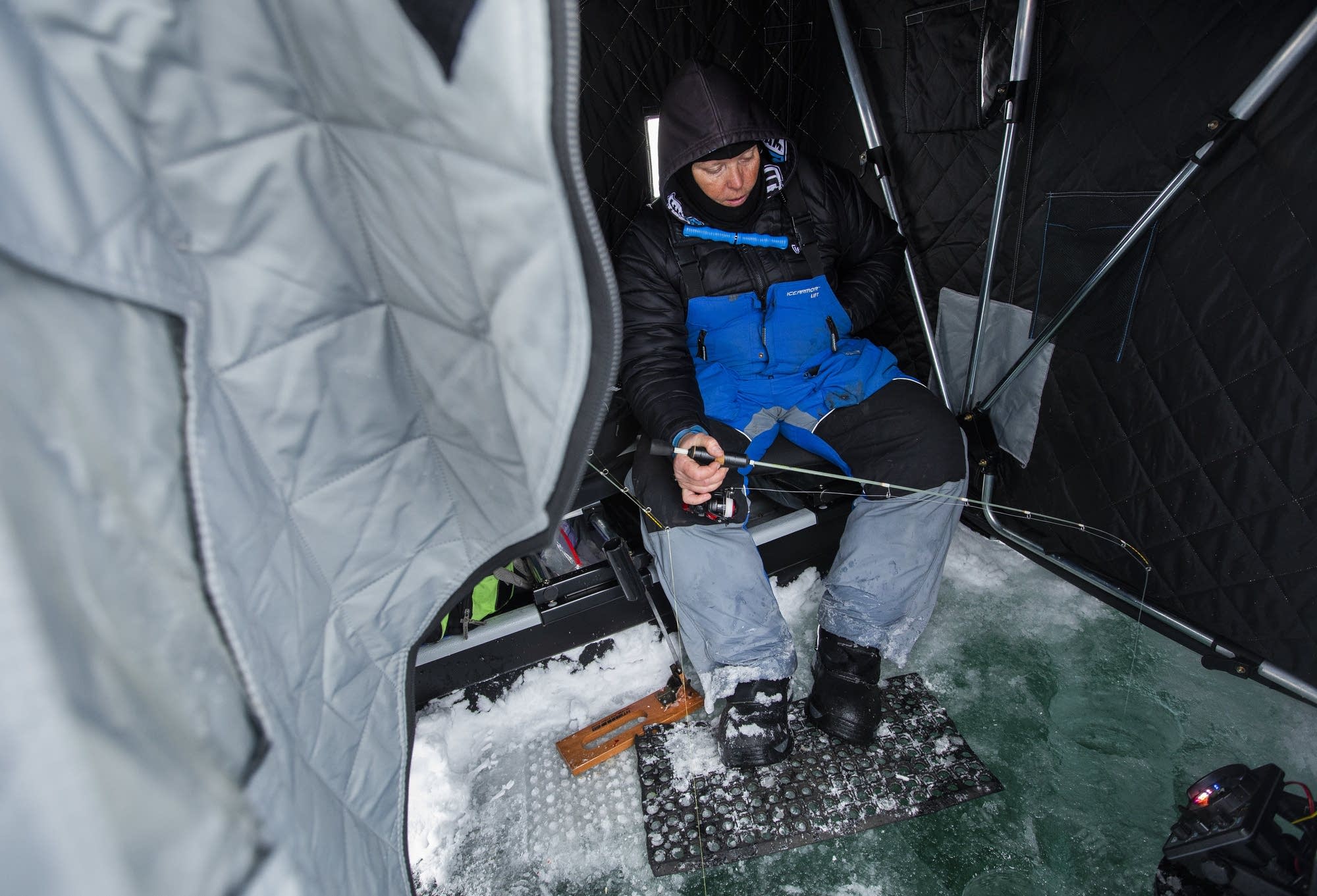 Barb Carey, founder of Wisconsin Women Fish, ice fishes.