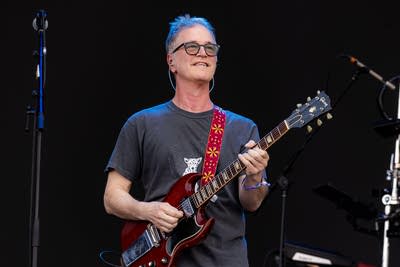 Semisonic perform on an outdoor stage.