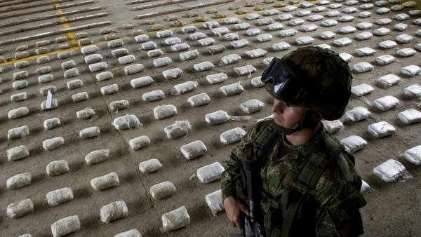 Above, a Colombian Army soldier near seized packages of cocaine in 2015.