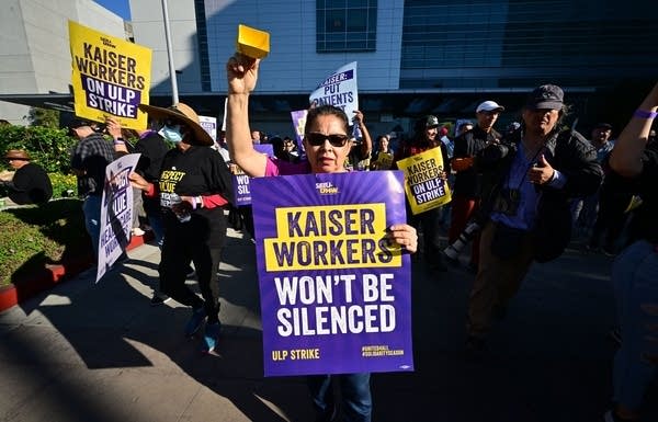 Kaiser Permanente employees, joined by Union members representing the workers, walk the picket line in Los Angeles, California on October 4, 2023. More than 75,000 employees at Kaiser Permanente began one of the largest healthcare worker strikes in recent US history on Wednesday after failing to resolve a dispute over staffing levels. 