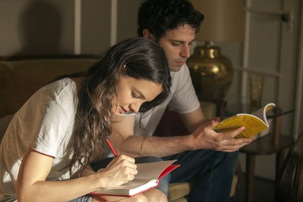 Carla (Katie Holmes) and Marco (Luke Kirby)