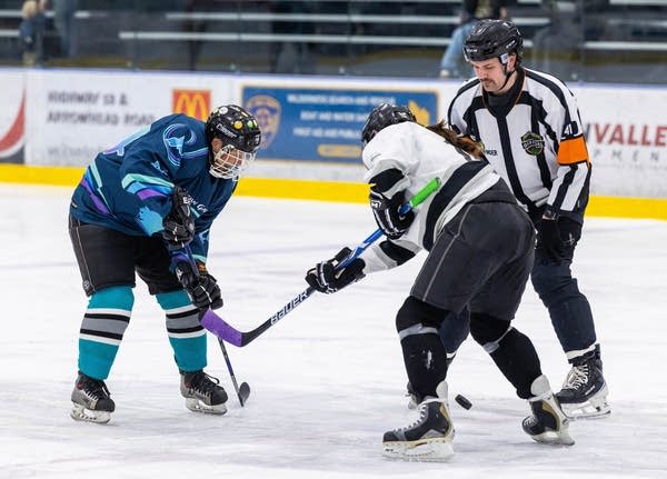 two players in faceoff dot