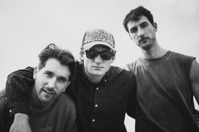 3 members of yam haus posing for an outdoor photo