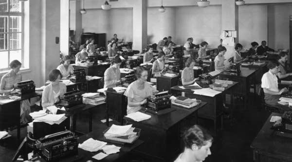 In office in London, circa 1934. One assumes attitudes toward sexual harassment have changed along with workplaces, but we want to hear your stories.