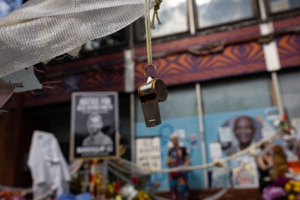 People visit a street memorial