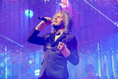 A musician sings onstage