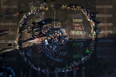 A large memorial with flowers as seen from above. 