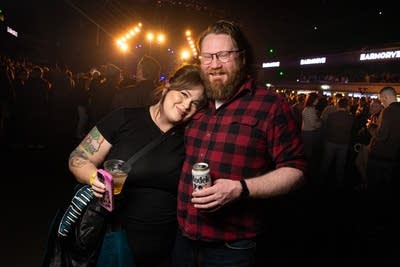 Two fans posing for a photo