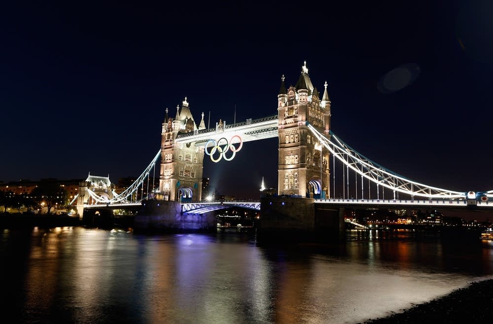 The Olympic rings hang from Tower Bridge