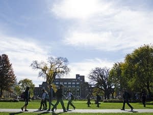 People walk in front of Coffman Memorial Union.