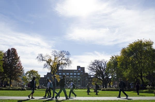 People walk in front of Coffman Memorial Union.