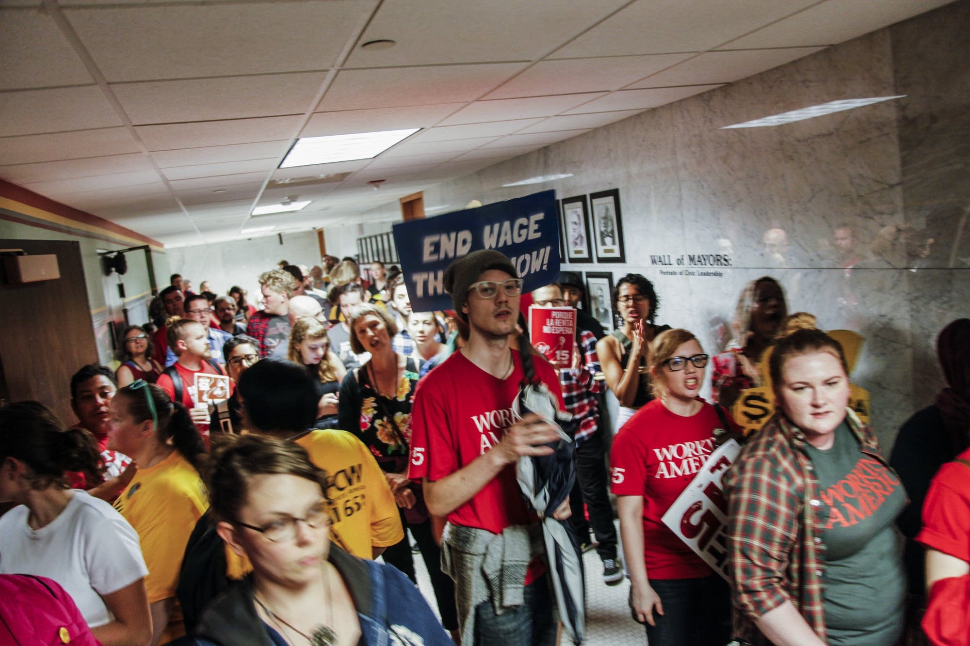 Minimum wage workers rally to raise the minimum wage to $15 at city hall