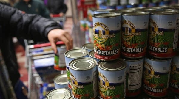 Residents choose free groceries at the Food Bank. Financial assistance for poor families in Georgia is being threatened by an accounting sleight-of-hand.