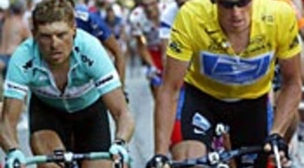 Lance Armstrong, in yellow jersey, and German Jan Ullrich ride during the Tour de France in 2003.