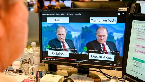 A AFP journalist views a video on January 25, 2019, manipulated with artificial intelligence to potentially deceive viewers, or "deepfake" at his newsdesk in Washington, DC.