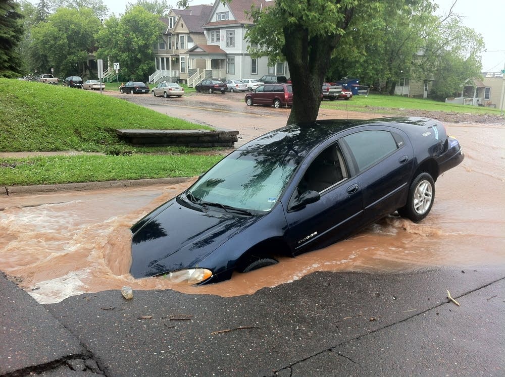 Sinkhole swallows car