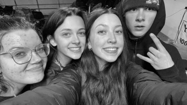 Band members pose for a photo