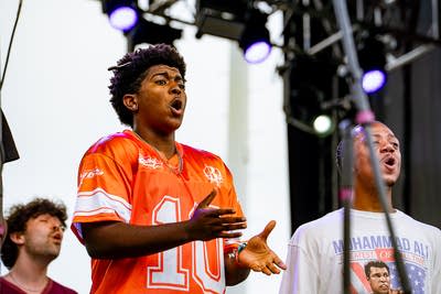 Known MPLS performing on an outdoor stage.