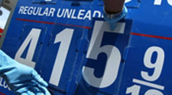 A gas price display is changed at a Chevron gasoline to display a record high.