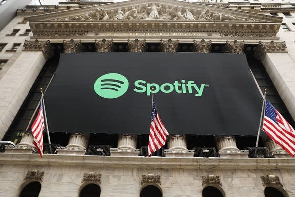 A Spotify banner hangs from the New York Stock Exchange (NYSE) on the morning that the music streaming service began trading shares at the NYSE on April 3, 2018 in New York City.