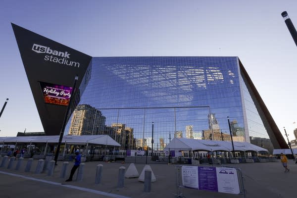 Exterior of U.S. Bank Stadium against a pale blue sky.