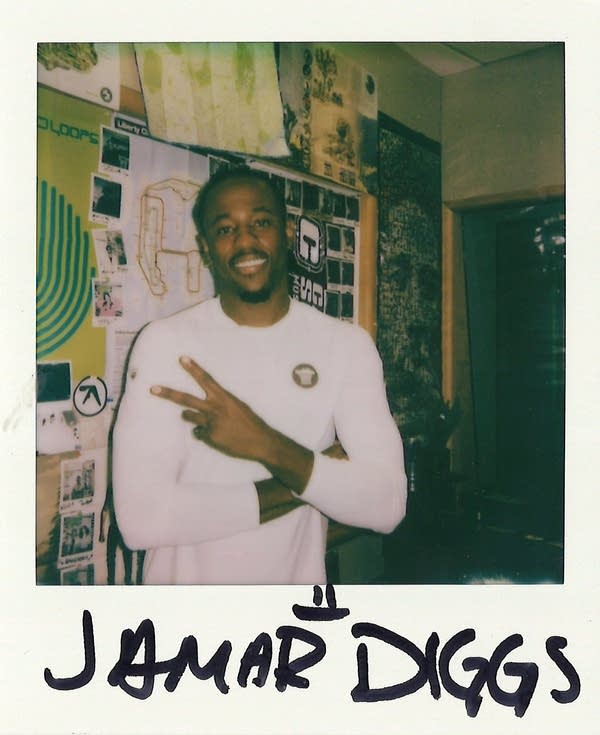 a signed polaroid with a man in it