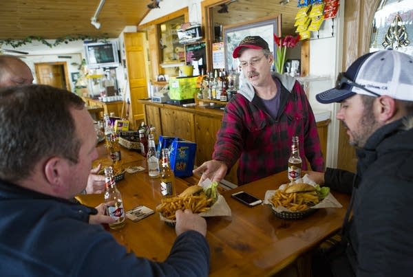 John Odle serves customers.