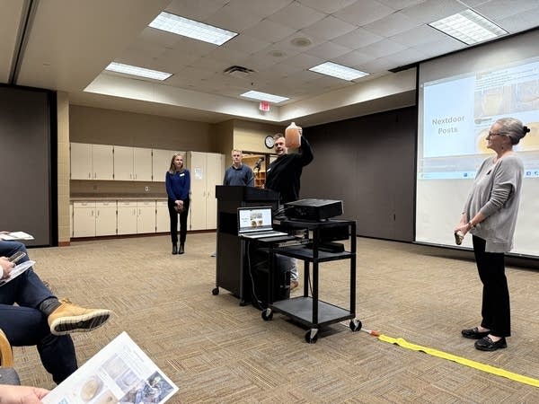 A man holds a gallon of water