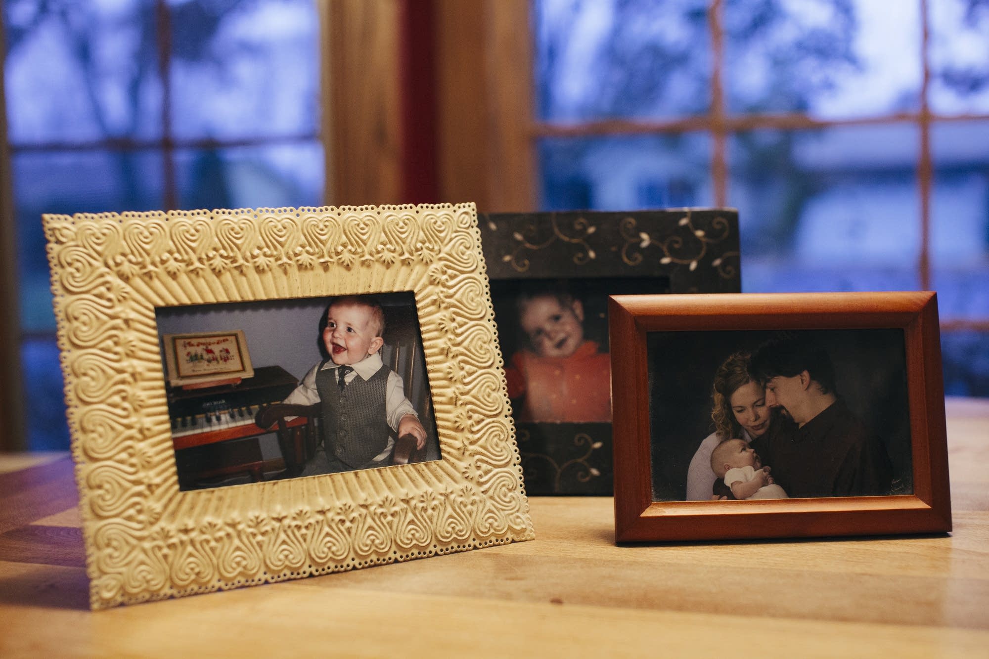 Photos of Ellis Bergstrom sit on his parents' kitchen table.