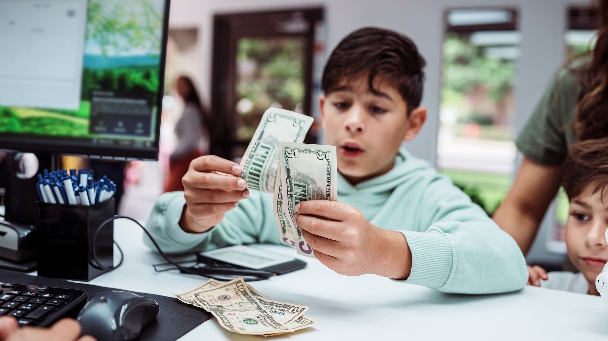 Paychecks, bills and reality: Teaching kids about money