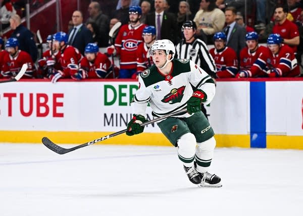 A hockey player skates on the rink during a game.