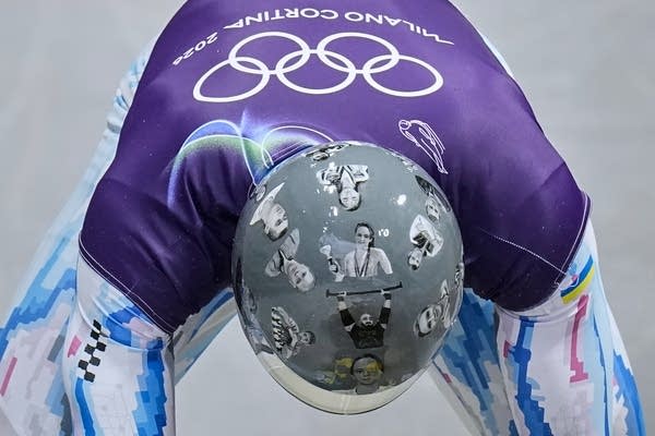 Ukrainian trains in helmet honoring fellow athletes killed in war. IOC says it's banned for race