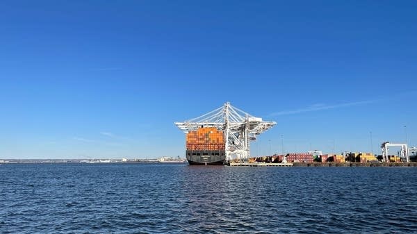 A cargo ship unloads containers at the Port of Baltimore. The port was inaccessible for over ten weeks after the Key Bridge collapsed, blocking the shipping channel.
