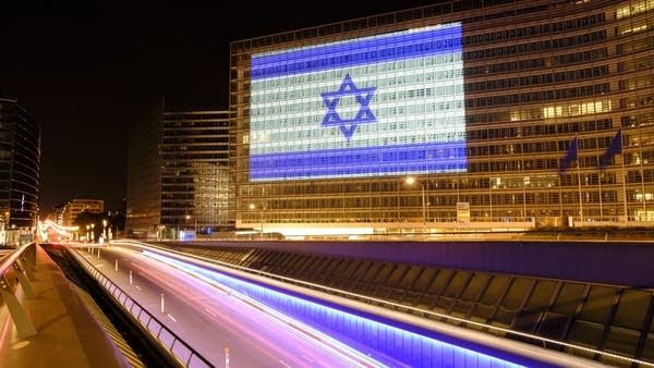 The Israeli flag is projected onto the EU Commission headquarters in Brussels on Oct. 8. 