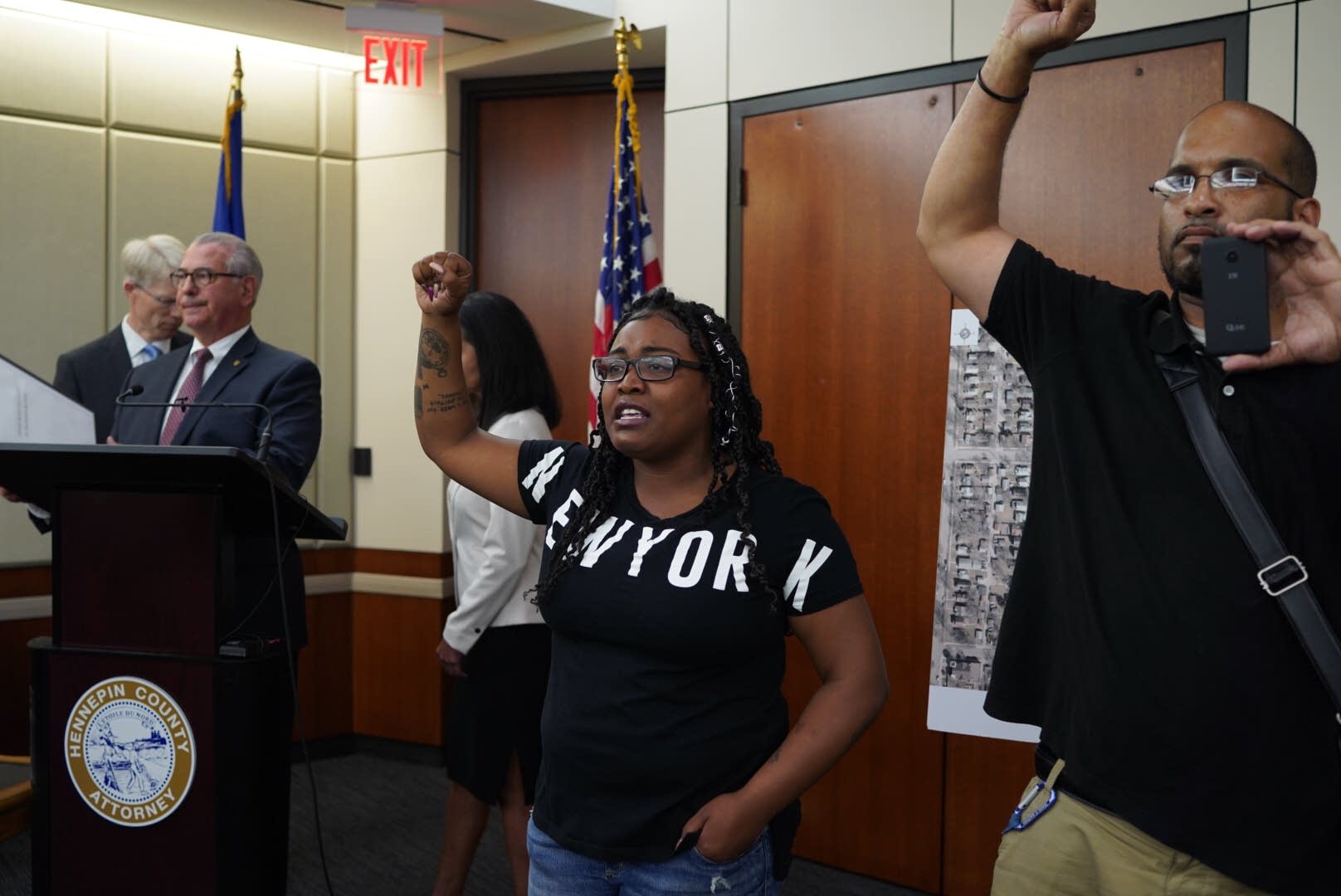 Community members interrupt Mike Freeman's news conference.