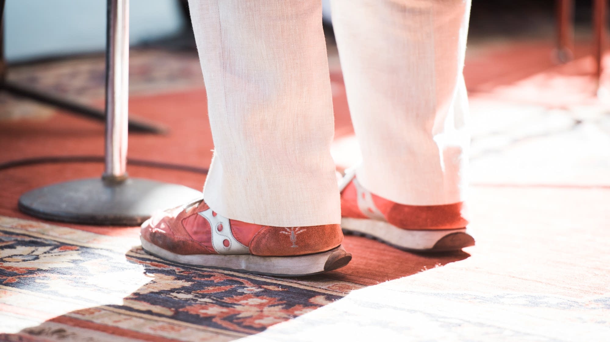 Keillor wears his signature red shoes on stage